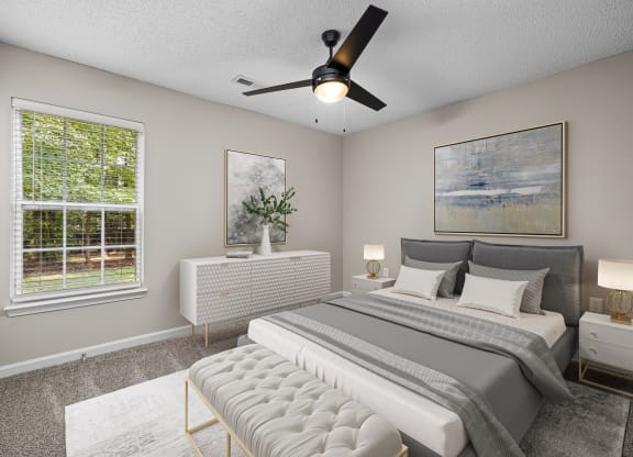 addison point interior staged model bedroom with a bed and a ceiling fan