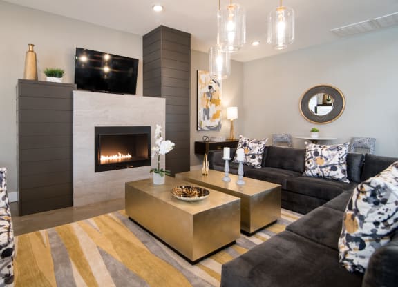 a living room with a fireplace and couches