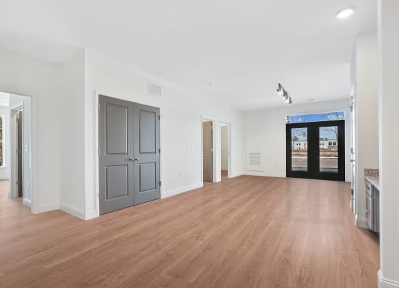 a living room with a hard wood floor and