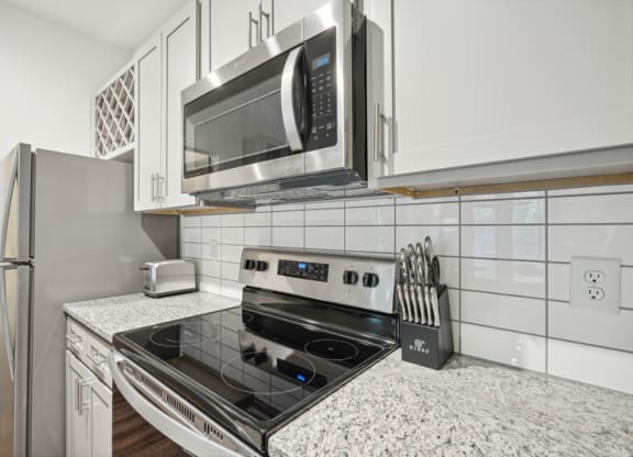 a kitchen with a stove and a microwave
