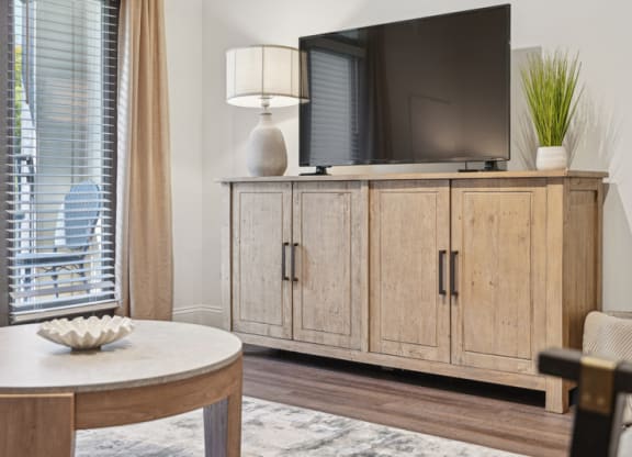 a living room with a tv and a table