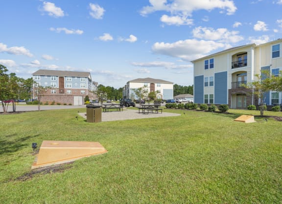 the preserve at ballantyne commons courtyard with grass and tables and buildings