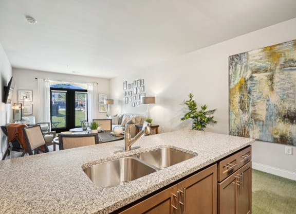 a kitchen with granite counter tops and a sink