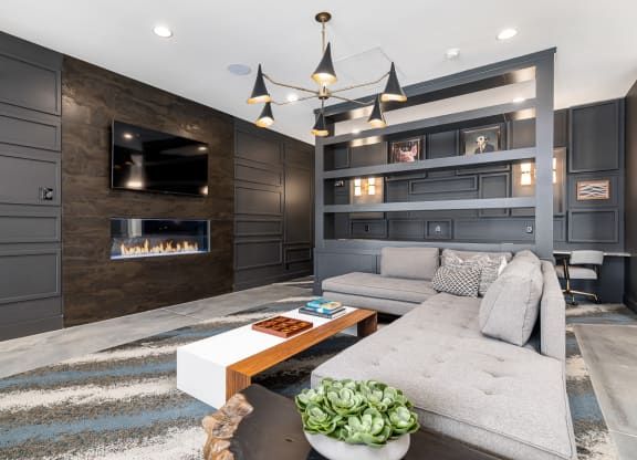 Clubroom with long couch and tv