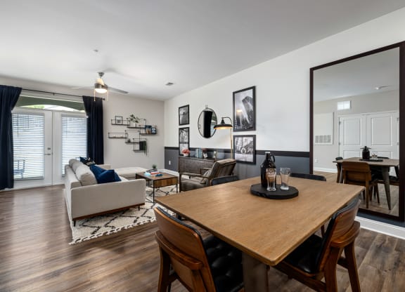 Brown wood floors and wooden dining table