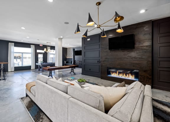 interior resident lounge with a couch and a fireplace