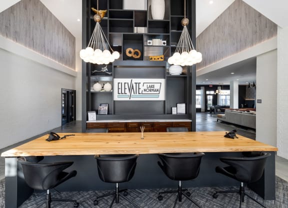 clubhouse entrance with a wooden table and black chairs