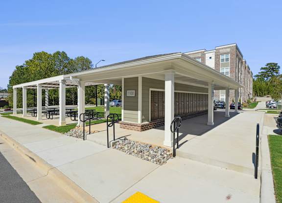 A covered walkway leads to a building with the number 1001 on it.