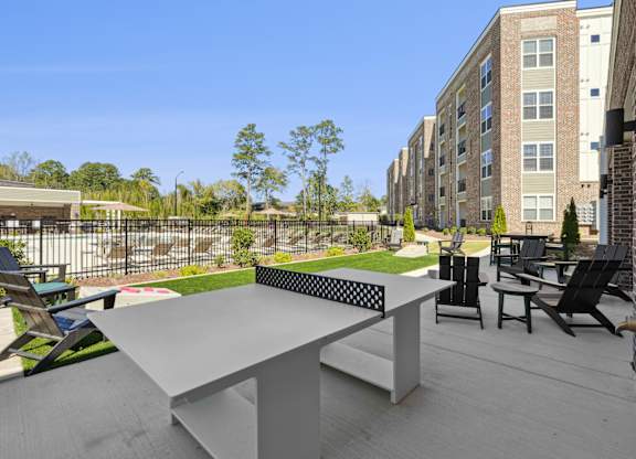A table and chairs are set up on a patio.