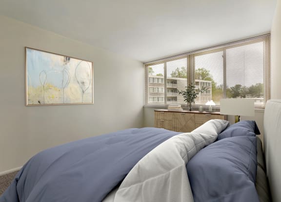 a bedroom with a bed and two windows