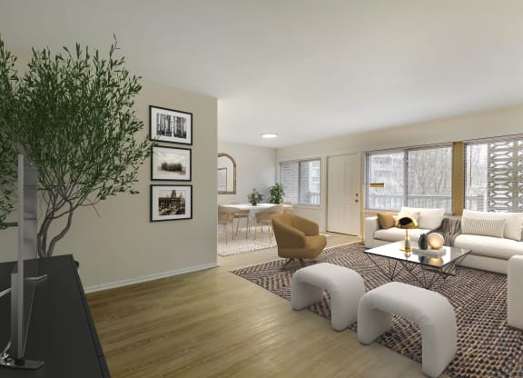 a living room with a couch and chairs and a table