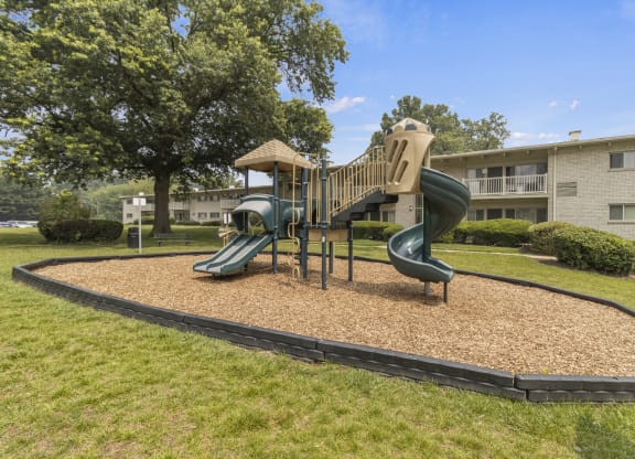 a playground at the whispering winds apartments in pearland, tx