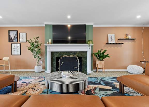 A living room with a fireplace and a chair.