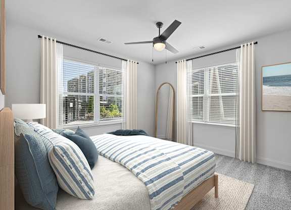 A bedroom with a large bed and a view of the beach.