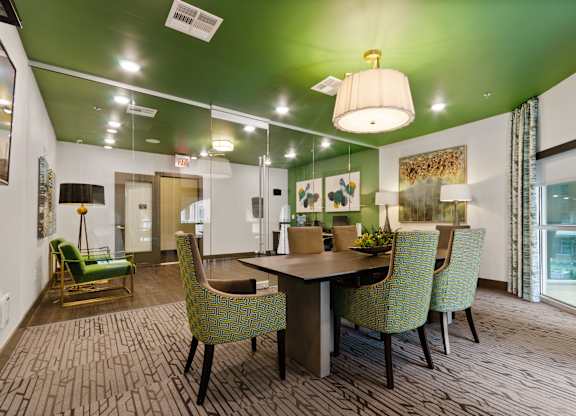 a dining room with a table and chairs