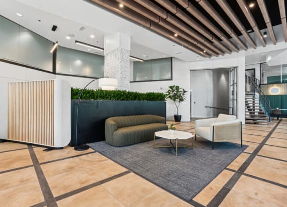 a lobby with a couch and a table