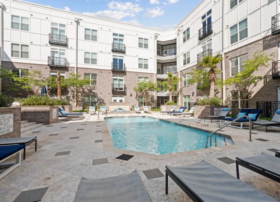 the swimming pool at the grotto apartments