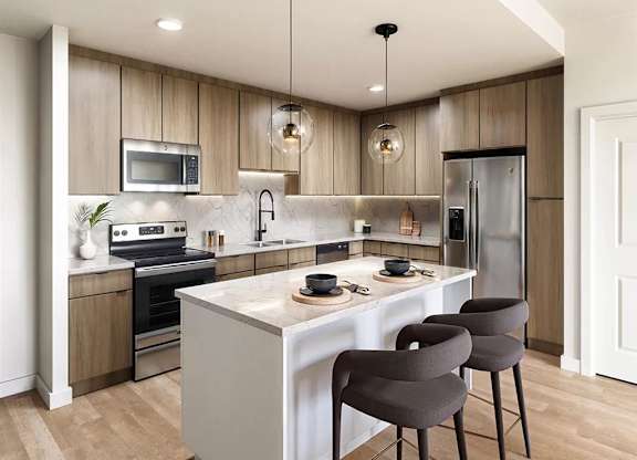 Contemporary kitchen with island and pendant lighting at Garden at 3Roots Apartments, California