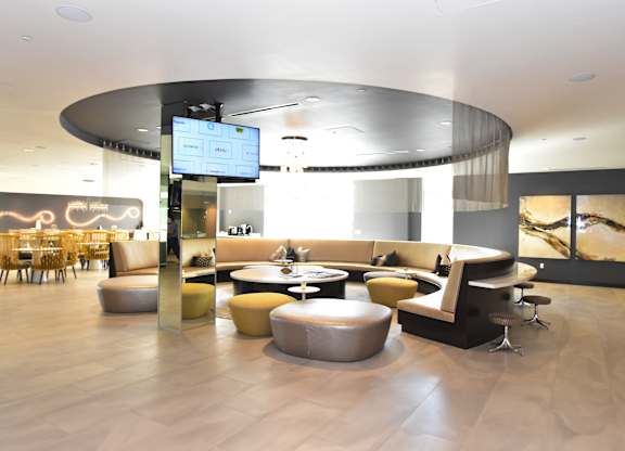 Modern lobby lounge with curved seating areas at 360 Luxury Apartments, California, 92122