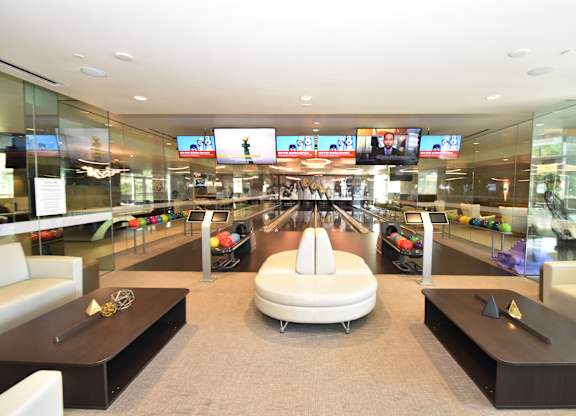 Private bowling lanes with lounge seating at 360 Luxury Apartments, San Diego
