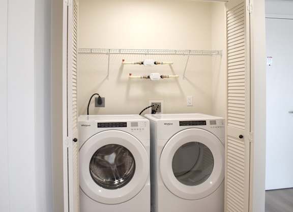 In unit laundry with front load washer and dryer at Garden at 3Roots Apartments, San Diego, CA 92126