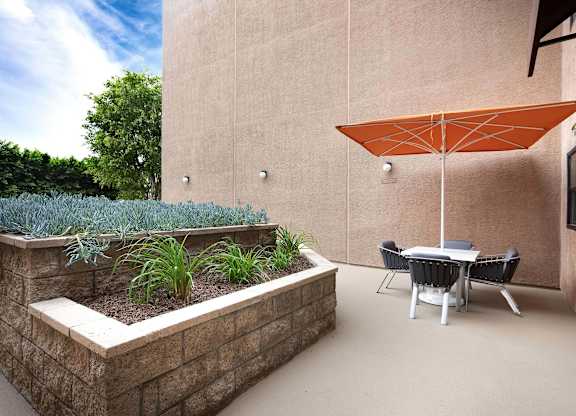 Patio with a Table and Chairs at Burbank Gardens Apartments, Sherman Oaks
