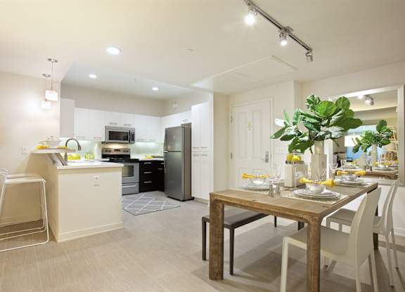 Open dining area and modern kitchen at Casa Mira View Apartments, California, 92126