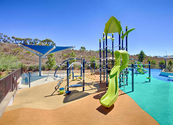 Playground with climbing structure and slides at Casa Mira View Apartments, San Diego, CA