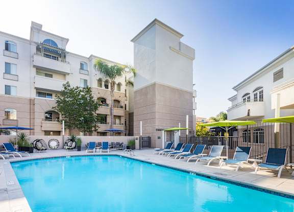 Swimming pool with surrounding apartment buildings at La Jolla Crossroads Apartments, California, 92122