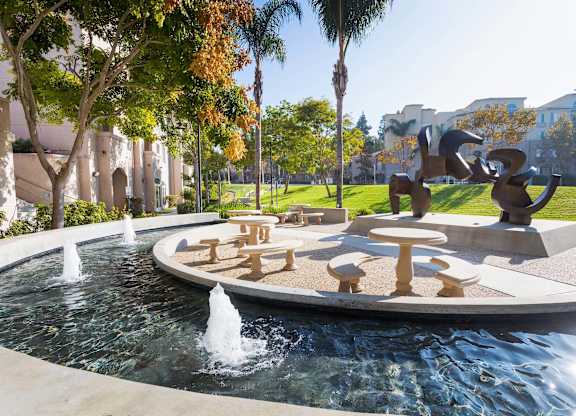 Decorative fountain with sculptural seating area at La Jolla Crossroads Apartments, California, 92122