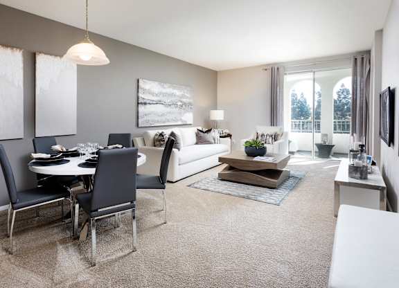 Open concept living and dining area with modern furnishings at La Jolla Crossroads Apartments, San Diego, CA