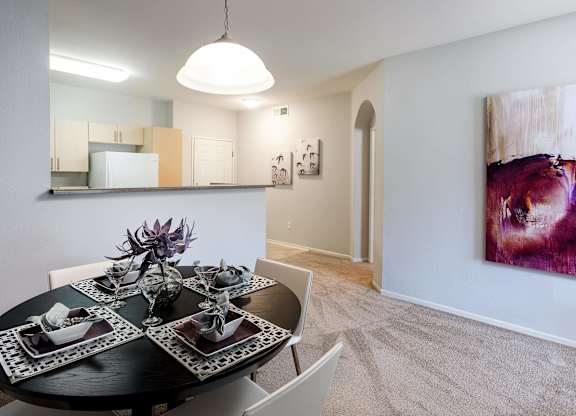 Dining area with modern table setting and artwork at La Jolla Crossroads Apartments, California, 92122