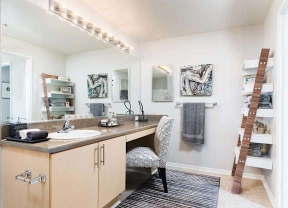 Bathroom vanity with built in makeup desk and shelving at La Jolla Crossroads Apartments, San Diego, 92122