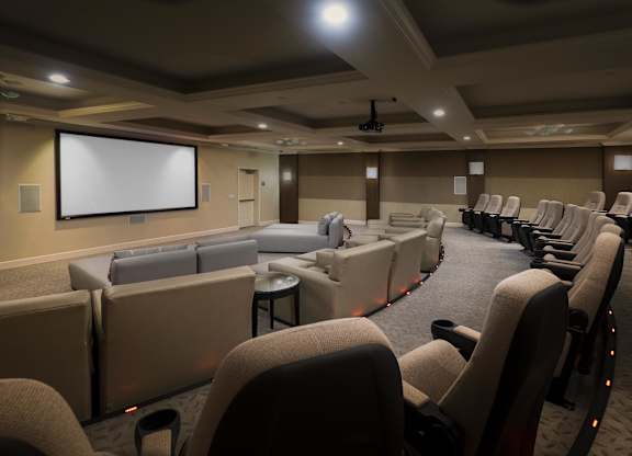 Private screening room with tiered theater seating at La Jolla Crossroads Apartments, San Diego, CA