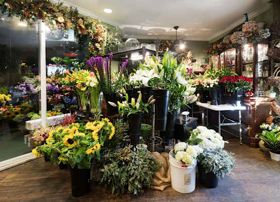 Flower shop interior with fresh bouquets and arrangements at La Jolla Crossroads Apartments, San Diego