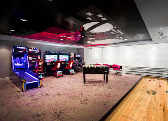 Game room with arcade machines at Metropolis Apartments, California, 92614