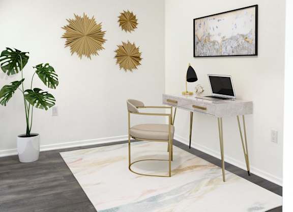 Modern home office with gold accent desk at Torrey Gardens Apartments, San Diego, California