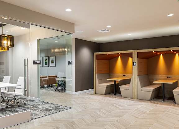 Private meeting booths with integrated task lighting at Elements Apartments, Irvine