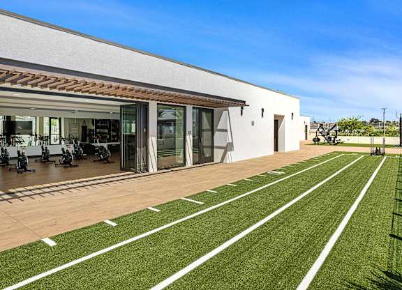 A 40-yard dash and a gym with stationary bikes in the background.