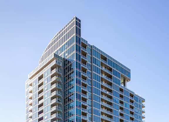 Modern high rise apartment building exterior at LUX by Garden* Apartments, San Diego, 92122