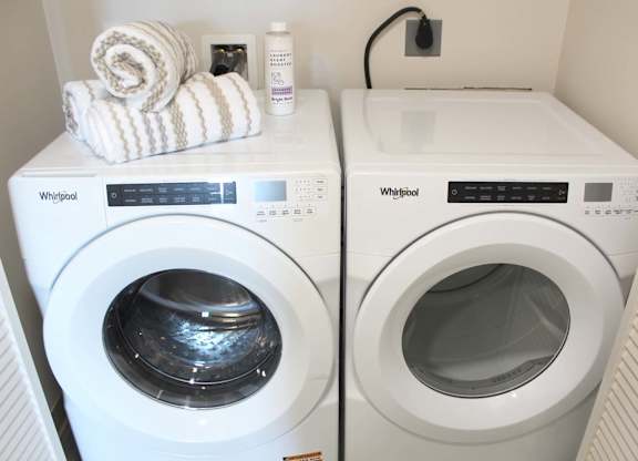 In unit washer and dryer with storage above at Garden at 3Roots Apartments, California