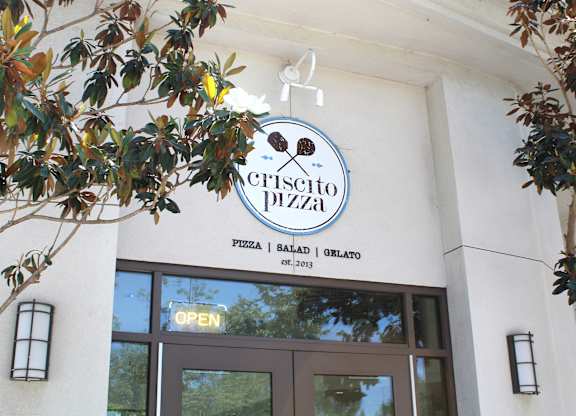 Criscito pizza restaurant storefront with trees at Torrey Gardens Apartments, San Diego, CA