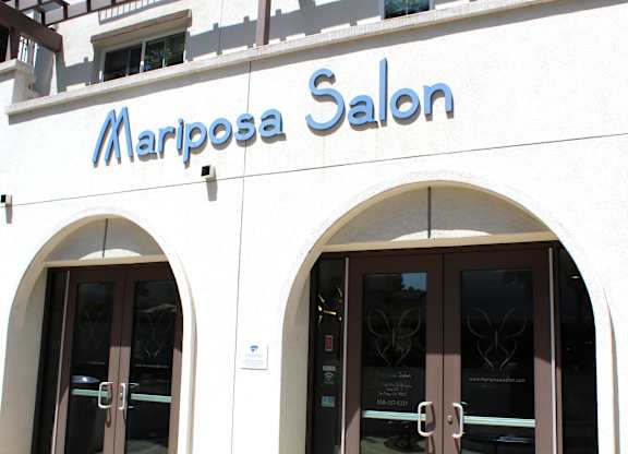 Mariposa salon storefront with arched entryways at Torrey Gardens Apartments, San Diego