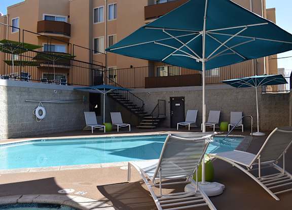 Swimming Pool with Relaxing Area at Encino Palms Apartments, Encino