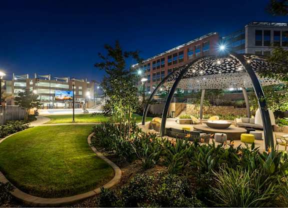 Evening courtyard with decorative pavilion and landscaping at 360 Luxury Apartments, San Diego, CA