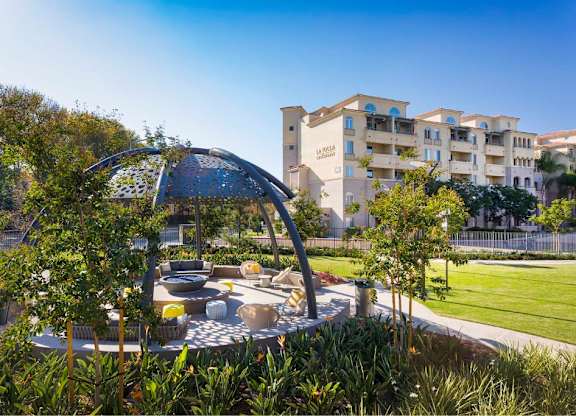 Outdoor patio with perforated dome canopy and fire pit at 360 Luxury Apartments, San Diego, California