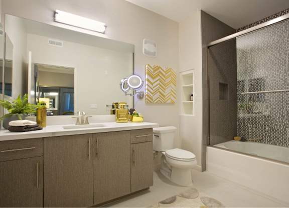 Modern bathroom with mosaic tile shower surround at 360 Luxury Apartments, San Diego, California