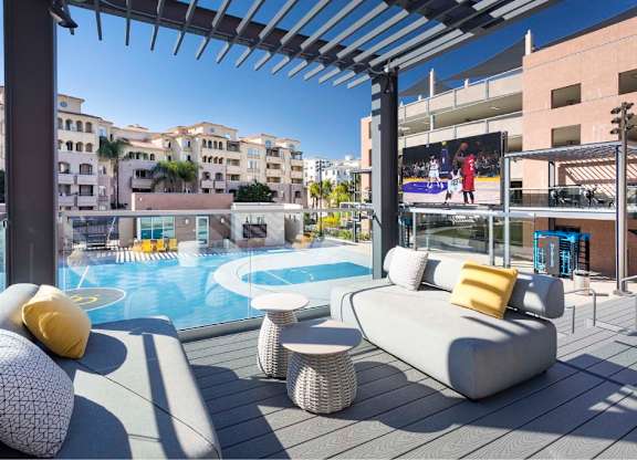 Rooftop lounge overlooking basketball court with video screen at 360 Luxury Apartments, San Diego