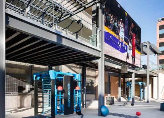 Outdoor fitness area with training equipment and pergola at 360 Luxury Apartments, San Diego, CA 92122