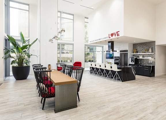 Modern community kitchen with dining area at LUX by Garden* Apartments, San Diego